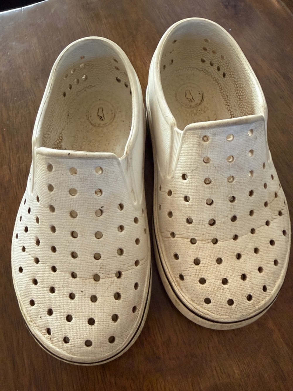 Native white slide on waterproof shoes. 10C